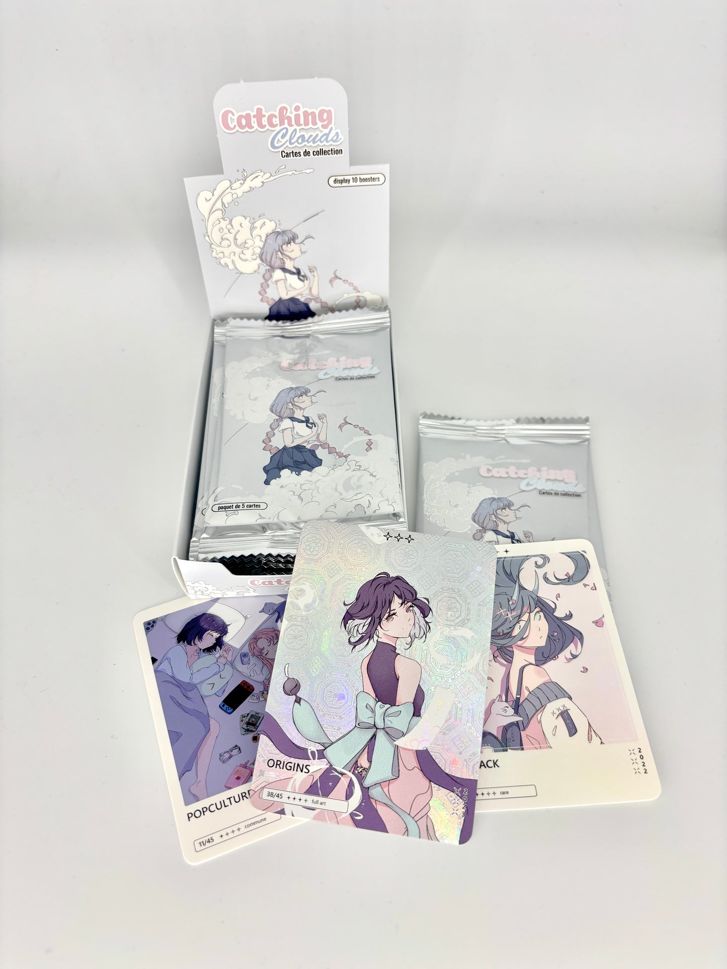 Display 12 boosters Série Catching Clouds